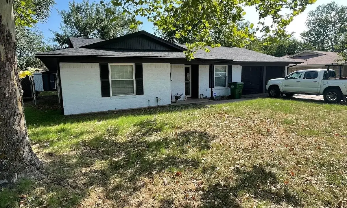 Professional roofing crew working on a residential roof in Maryland City